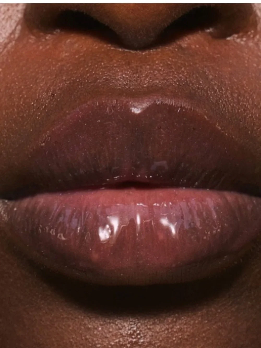 LALICIOUS Hydrating Butter Gloss SPF 30 in Berry Bomb shine shield plump hydrate